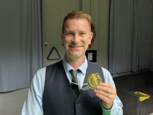 Andrew Norman shows his winner's medal