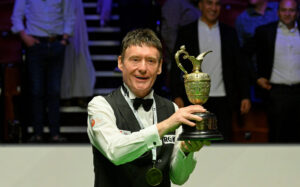 Jimmy White lifts the World Seniors Snooker Championship trophy.