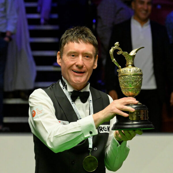 Jimmy White lifts the World Seniors Snooker Championship trophy.