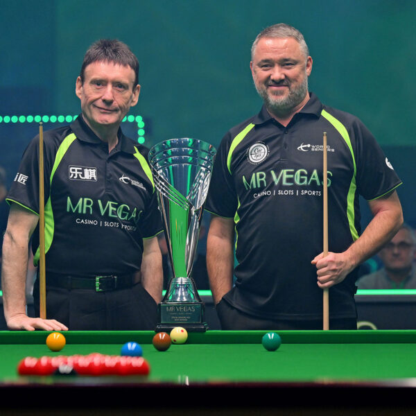 Jimmy White and Stephen Hendry pose before the final by the baulk end of the table with the trophy in front and in between them.